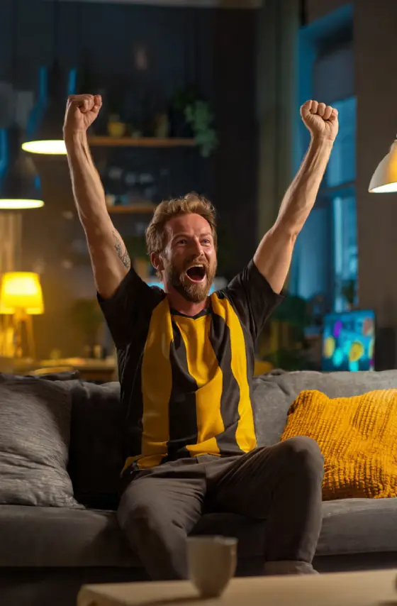Sports fan in the USA cheering at a game on IPTV